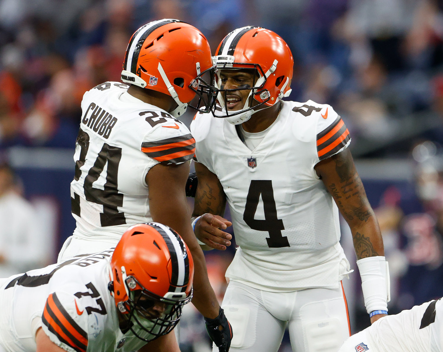 Cleveland Browns quarterback Deshaun Watson (4) talks with running back Nick Chubb (24) to change a play before the snap during an NFL game between the Houston Texans and the Cleveland Browns on Dec. 4, 2022, in Houston. The Browns won, 27-14.