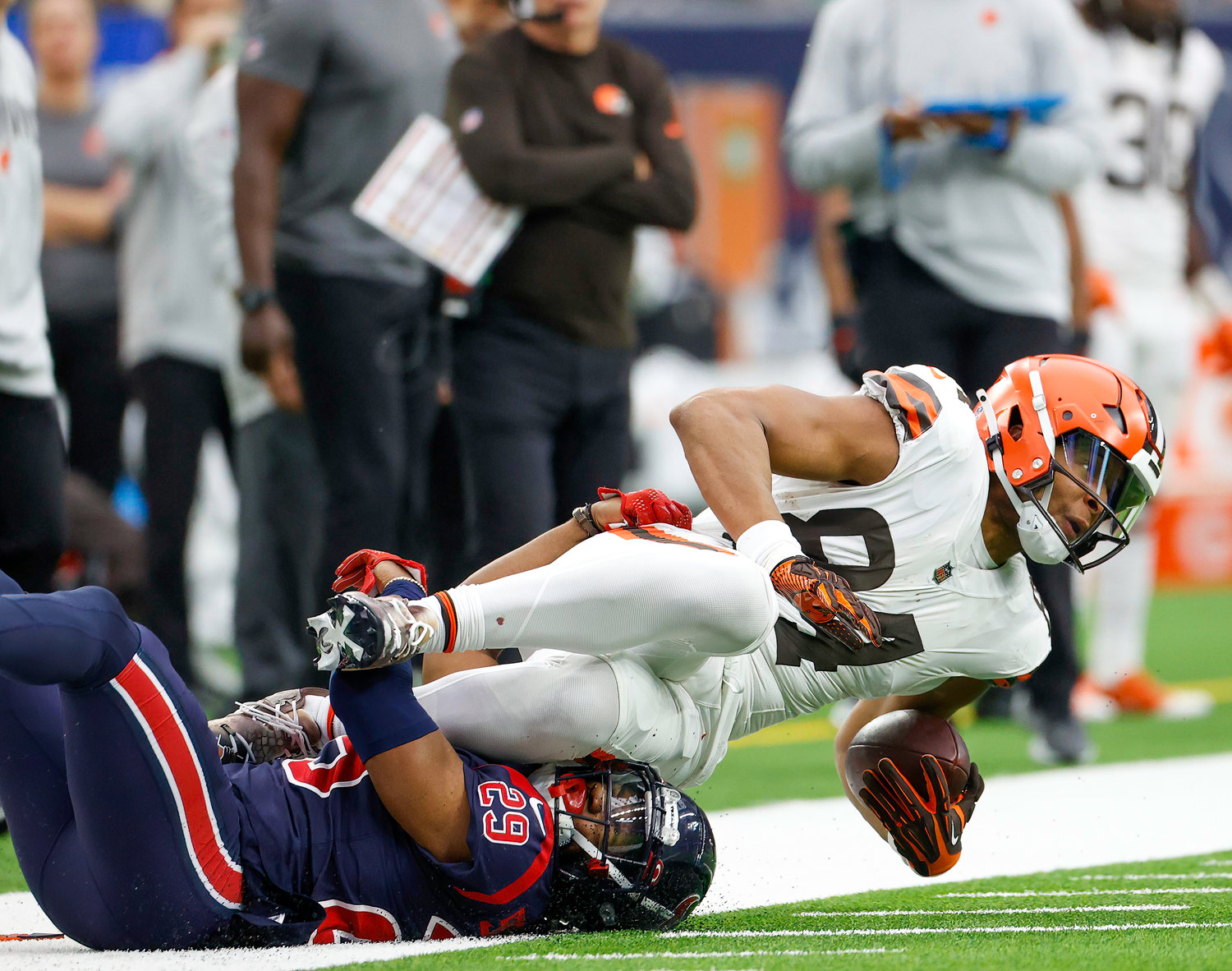 Cleveland Browns tight end Pharaoh Brown (84) is tackled by Houston Texans safety M.J. Stewart (29) during an NFL game between the Houston Texans and the Cleveland Browns on Dec. 4, 2022, in Houston. The Browns won, 27-14.