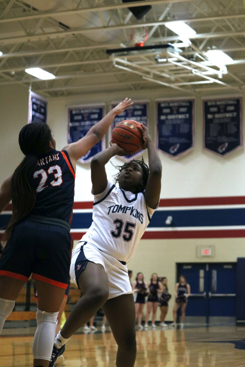 Fiyinfoluwa Adeleye shoots a fadeaway during Tuesday’s District 19-6A game between Tompkins and Seven Lakes at the Tompkins gym.