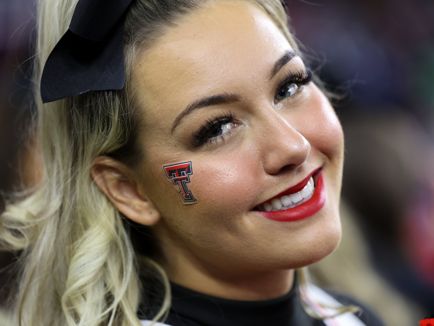 A Texas Tech cheerleader on the field before the start of the TaxAct Texas Bowl on Dec. 28, 2022 in Houston.