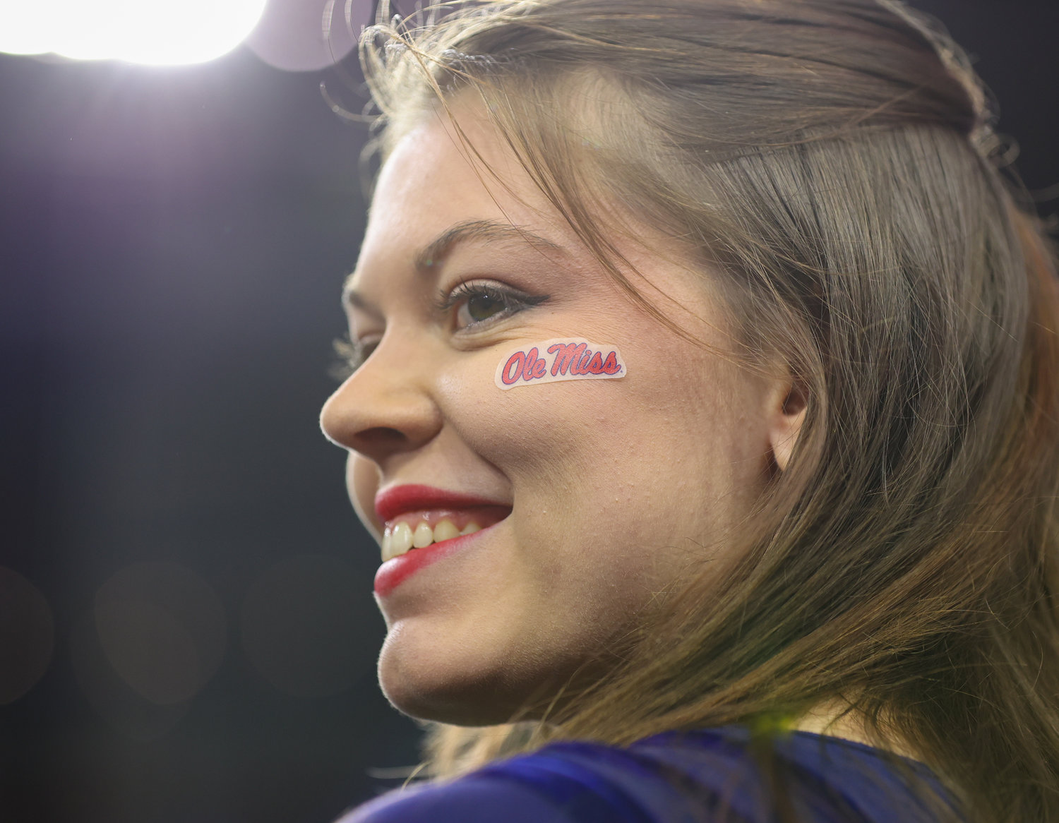 An Ole Miss cheerleader on the field before the start of the TaxAct Texas Bowl on Dec. 28, 2022 in Houston.