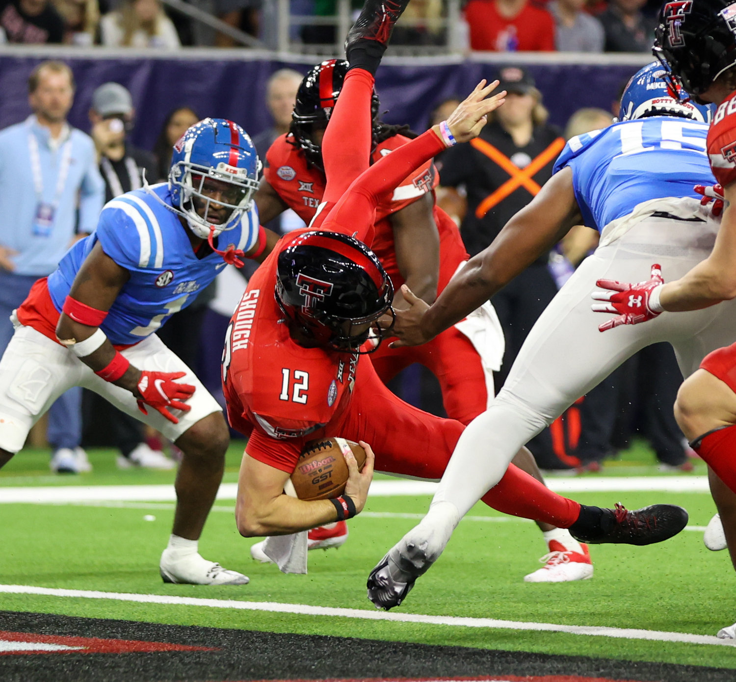 Texas Tech quarterback Tyler Shough (12) dives into the end zone for a rushing touchdown during the TaxAct Texas Bowl on Dec. 28, 2022 in Houston.