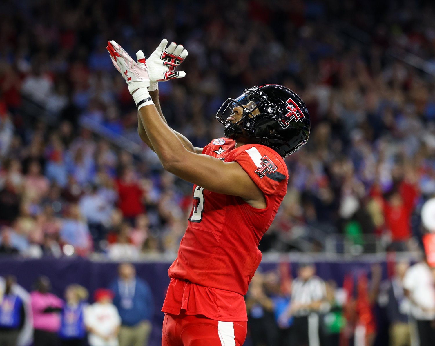 Texas Tech wide receiver Jerand Bradley (9) gestures to the crowd after a 2nd quarter touchdown catch during the TaxAct Texas Bowl on Dec. 28, 2022 in Houston.