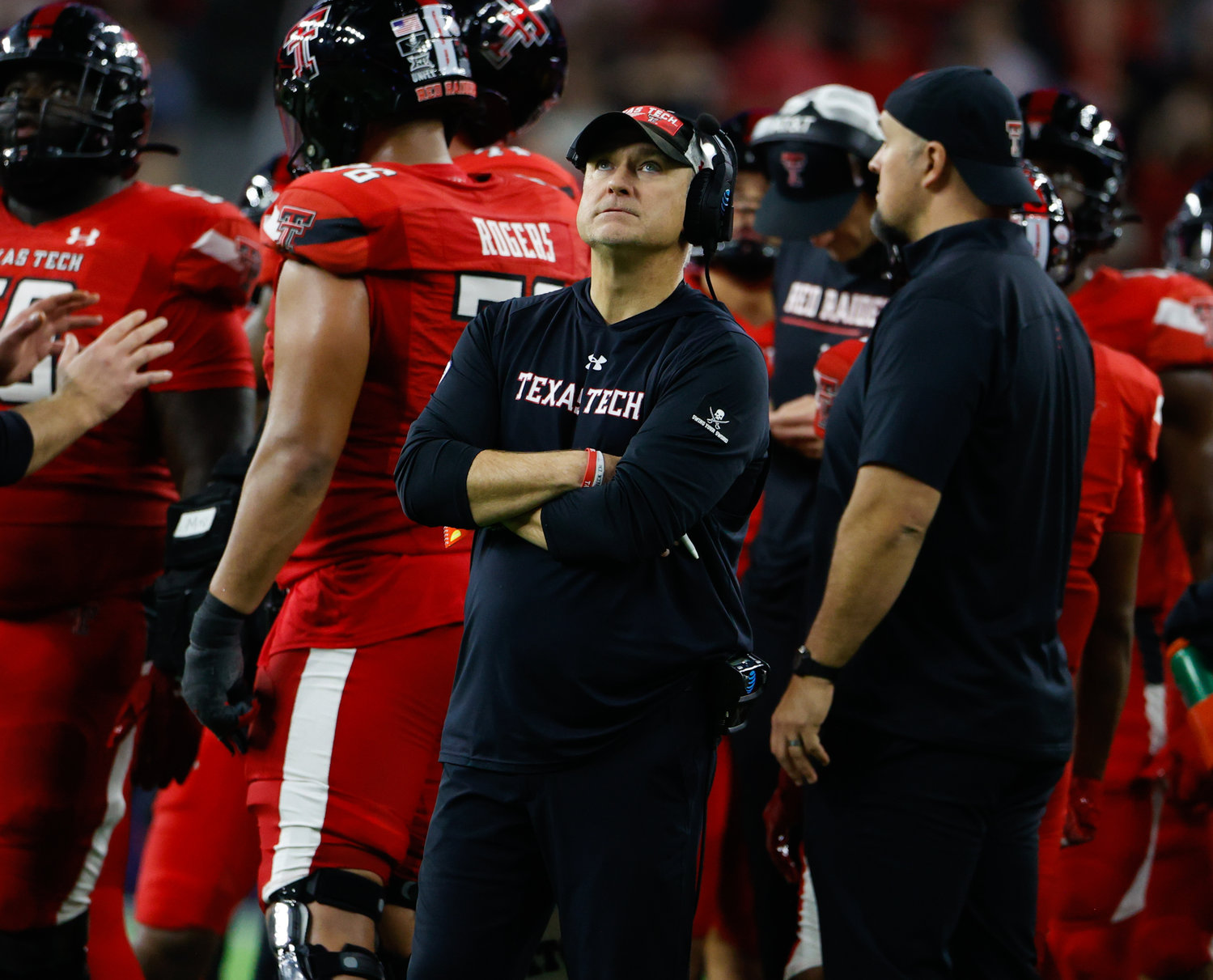 Texas Tech head coach Joey McGuire looks up at the video board for a replay during the TaxAct Texas Bowl on Dec. 28, 2022 in Houston.