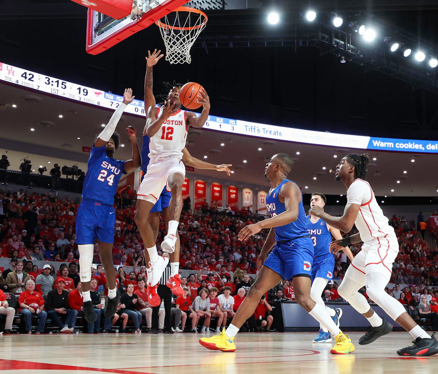 Houston guard Tramon Mark (12) goes to the basket during an NCAA men’s basketball game between the Houston Cougars and the Southern Methodist Mustangs on Jan. 5, 2023 in Houston. Houston won, 87-53,