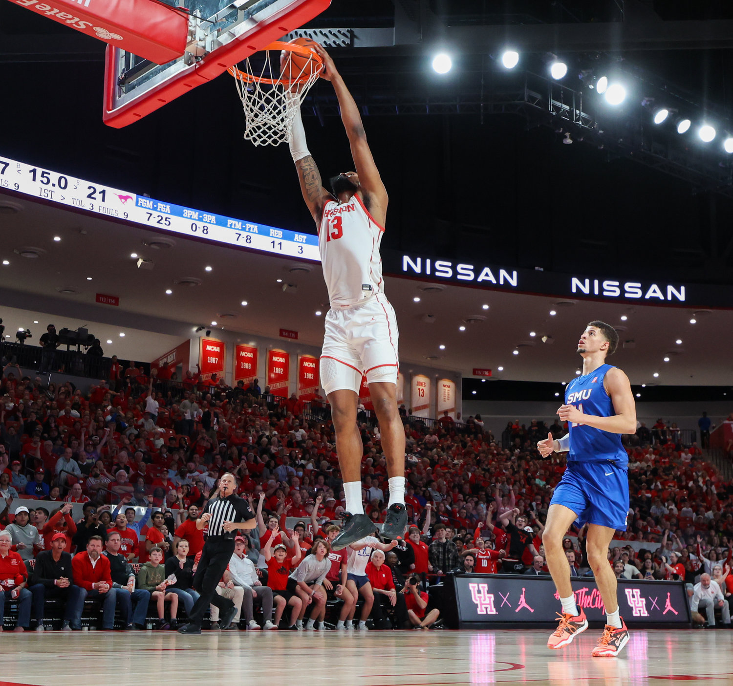 Houston forward J'Wan Roberts (13) dunks the ball during an NCAA men’s basketball game between the Houston Cougars and the Southern Methodist Mustangs on Jan. 5, 2023 in Houston. Houston won, 87-53,
