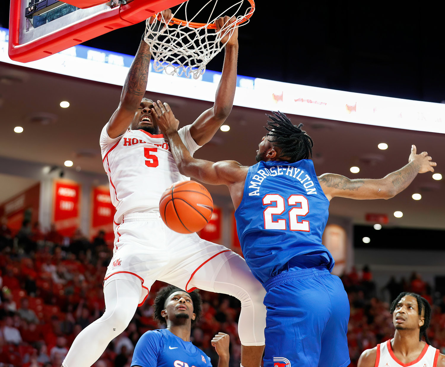Houston forward Ja'Vier Francis (5) dunks the ball during an NCAA men’s basketball game between the Houston Cougars and the Southern Methodist Mustangs on Jan. 5, 2023 in Houston. Houston won, 87-53,