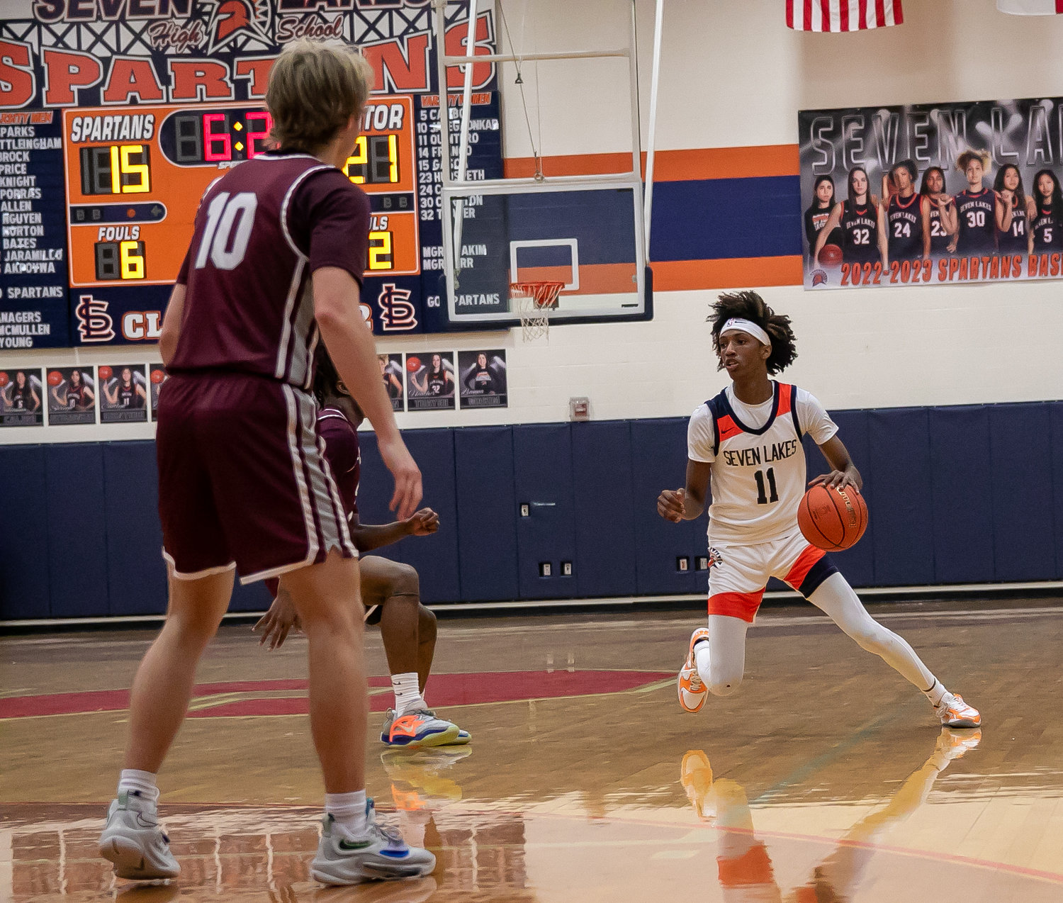 Nasir Price scans the court during Saturday's game between Seven Lakes and Cinco Ranch at the Seven Lakes gym.