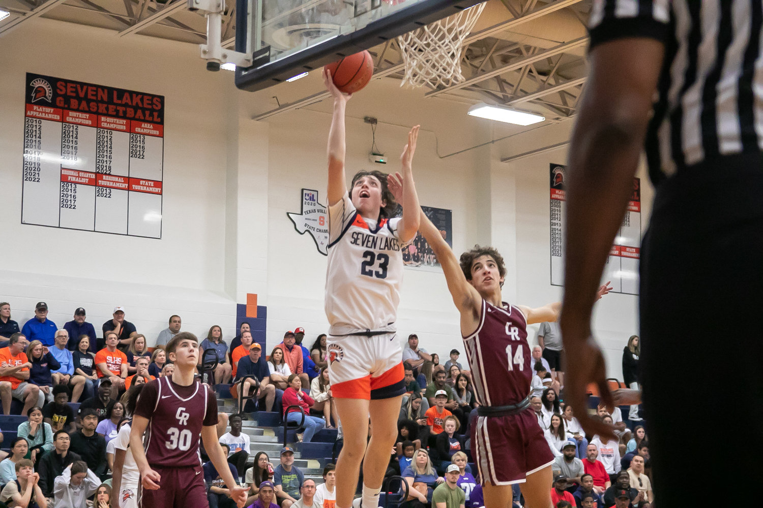 Brett Norton shoots a layup during Saturday's game between Seven Lakes and Cinco Ranch at the Seven Lakes gym.