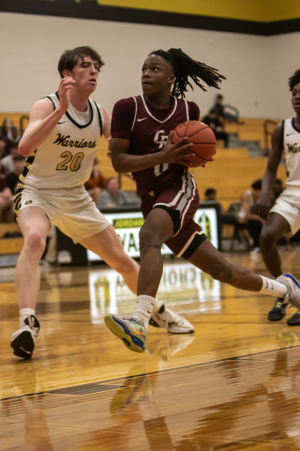 Prince Jones Bynum drives into the lane during Tuesday's game between Cinco Ranch and Jordan at the Jordan gym.