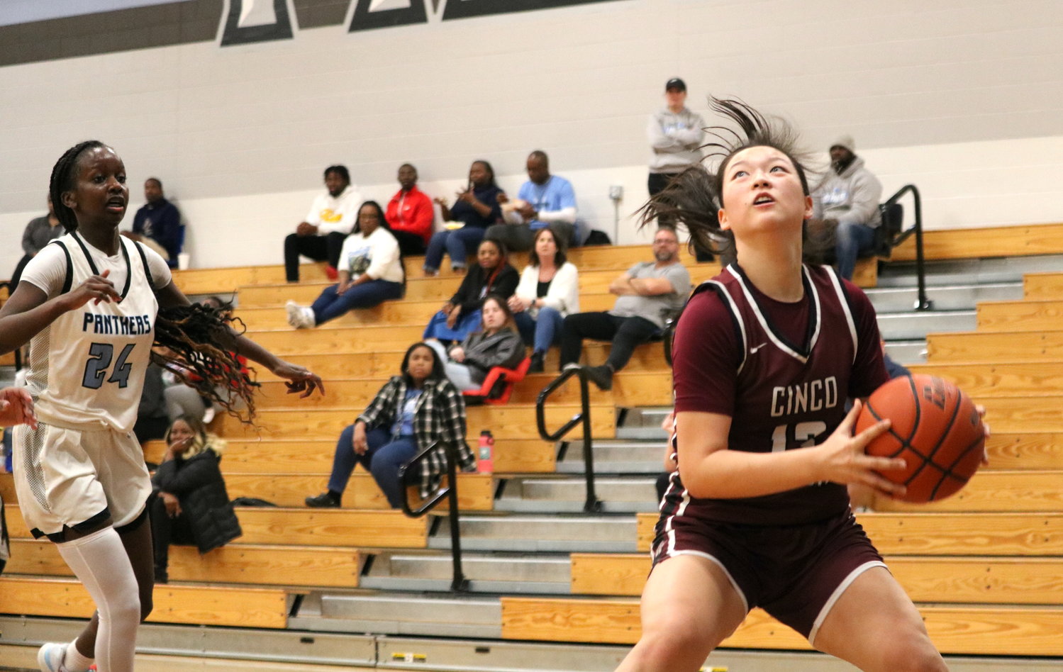 Madison Lee gathers after bringing in a pass during Friday's game between Cinco Ranch and Paetow at the Paetow gym.