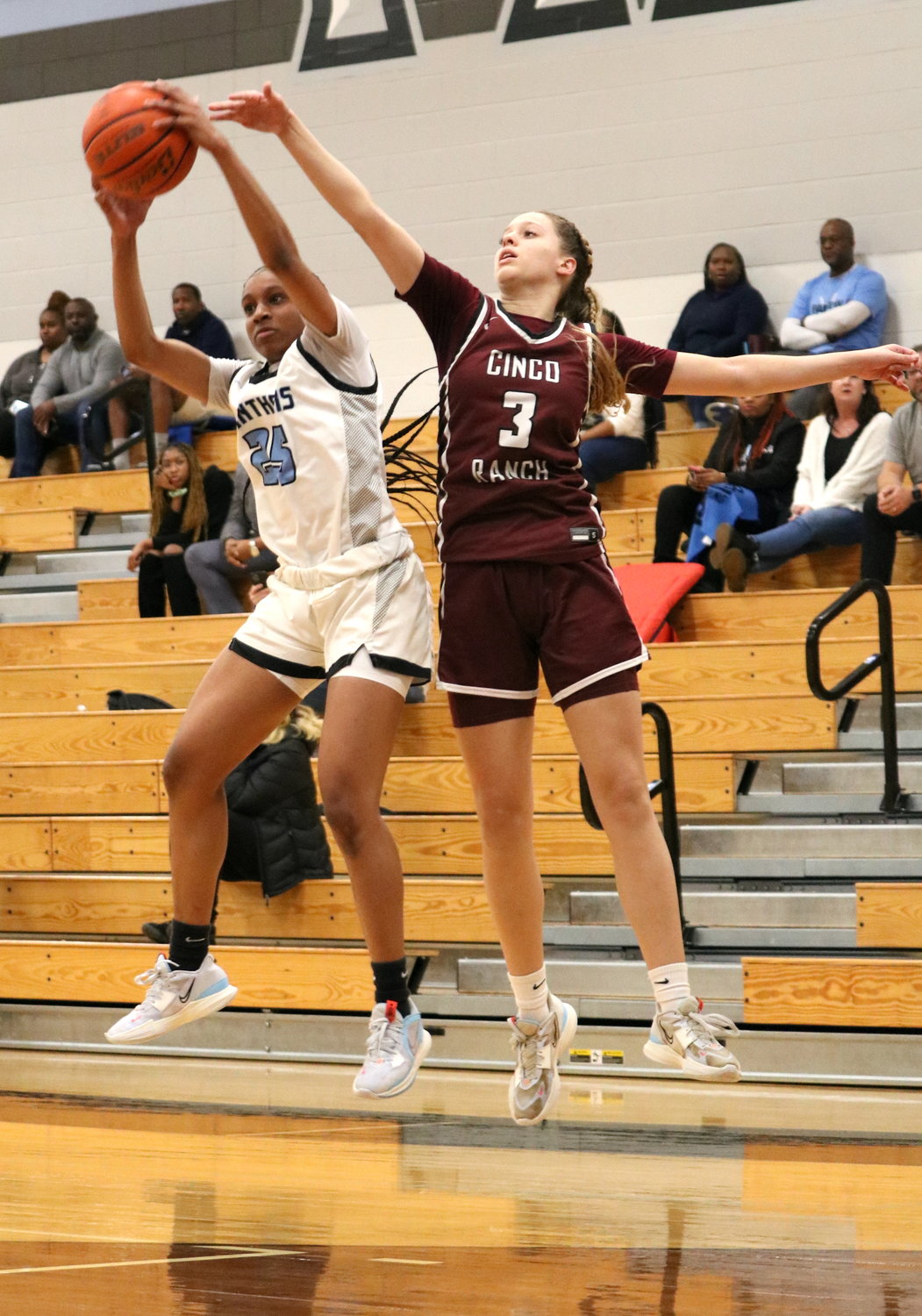 Tiera Hall pulls down a rebound during Friday's game between Cinco Ranch and Paetow at the Paetow gym.