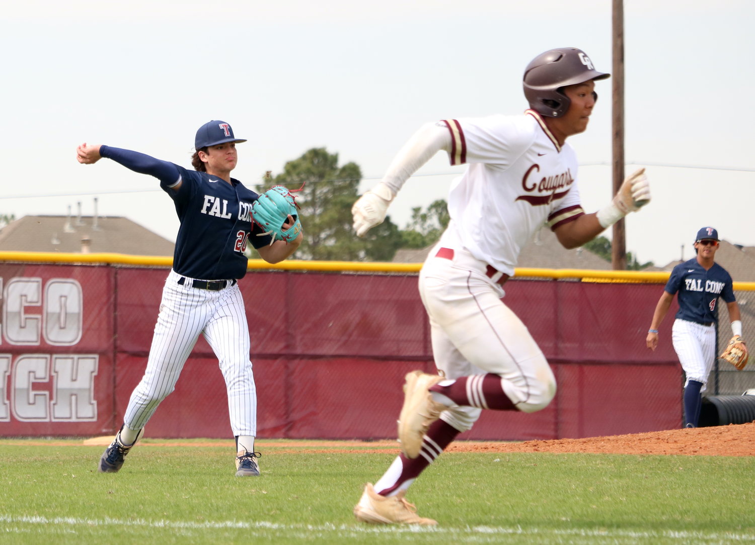 Gavin Brewer throws the ball to first base during Tuesday's game between Tompkins and Cinco Ranch at the Cinco Ranch baseball field.