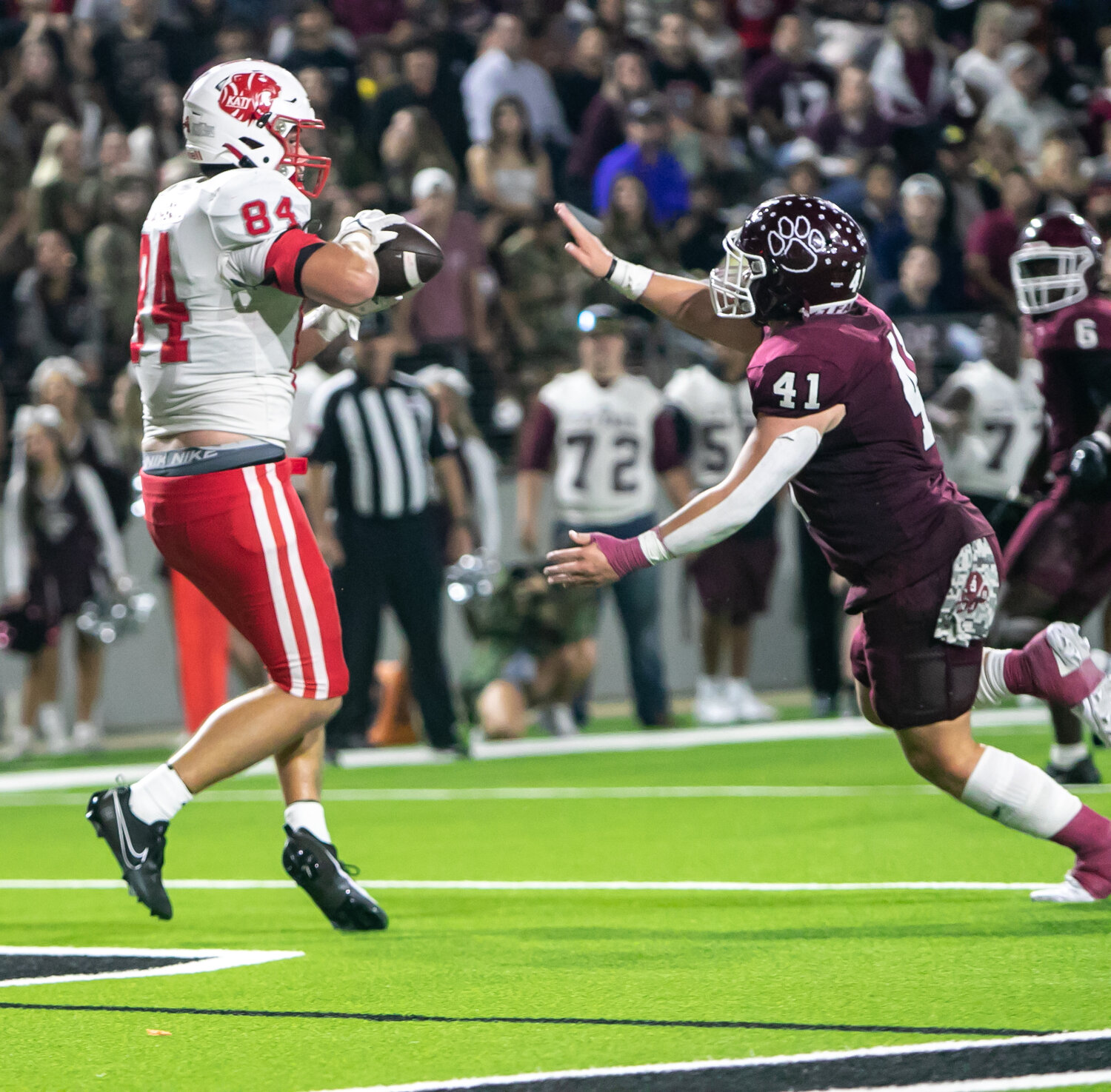 Luke Carter catches a touchdown pass during Friday's area round game between Katy and Cy-Fair at the Berry Center in Cypress.