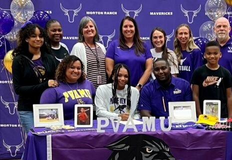 Morton Ranch student athletes pose for a photo on national signing day.