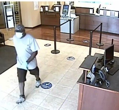 Security footage shows the suspect fleeing the bank after the robbery.