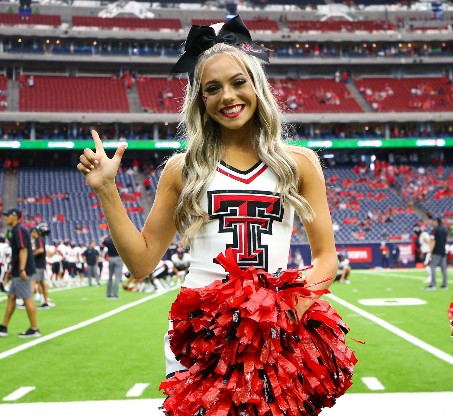 A Texas Tech Red Raiders cheerleader before the start of an NCAA football game between Houston and Texas Tech on September 4, 2021 in Houston, Texas.