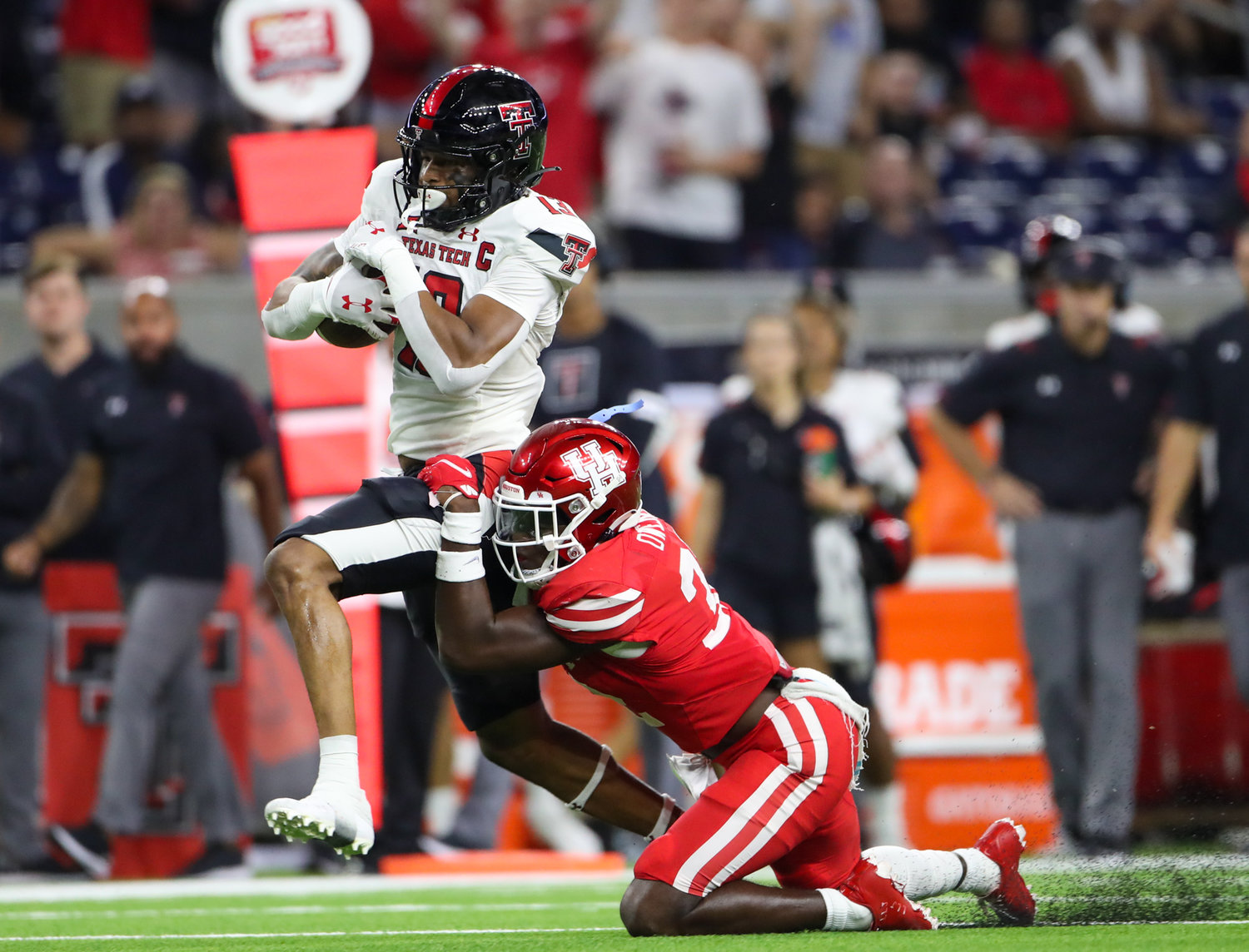 Texas Tech Red Raiders wide receiver Erik Ezukanma (13) carries the ball after a reception during an NCAA football game between Houston and Texas Tech on September 4, 2021 in Houston, Texas.