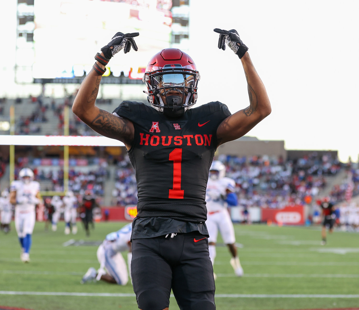 Houston Cougars wide receiver Nathaniel Dell (1) gestures after scoring on a 48-yard touchdown reception during an NCAA football game between Houston and SMU on October 30, 2021 in Houston, Texas.