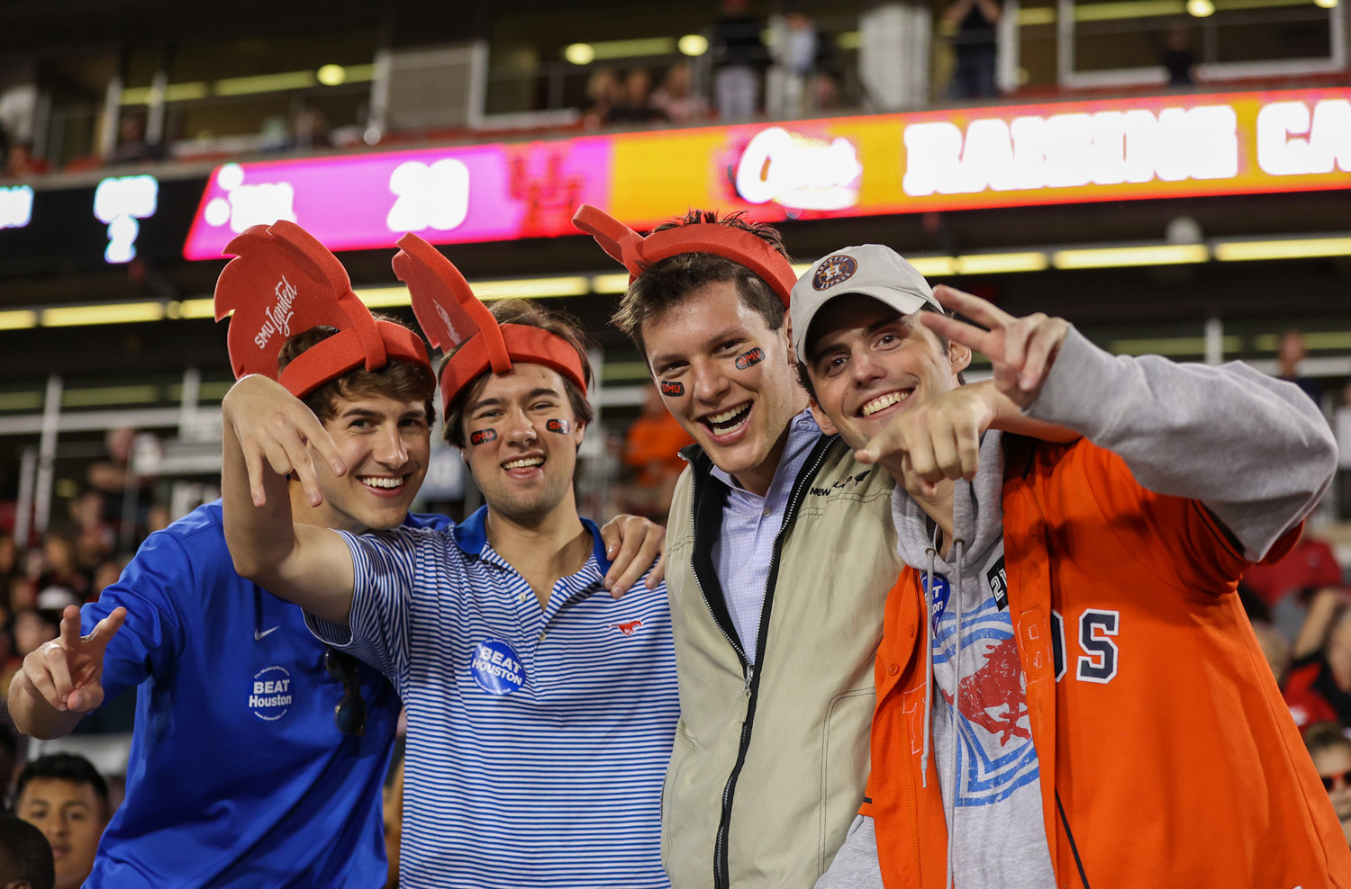 A group of SMU students occupy seats in the home section during an NCAA football game between Houston and SMU on October 30, 2021 in Houston, Texas.