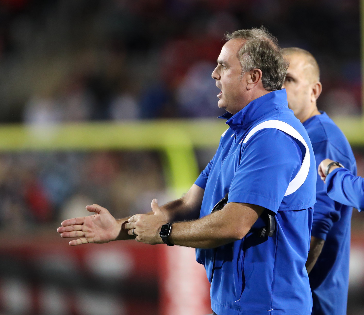 SMU Mustangs head coach Sonny Dykes argues with a game official during an NCAA football game between Houston and SMU on October 30, 2021 in Houston, Texas.
