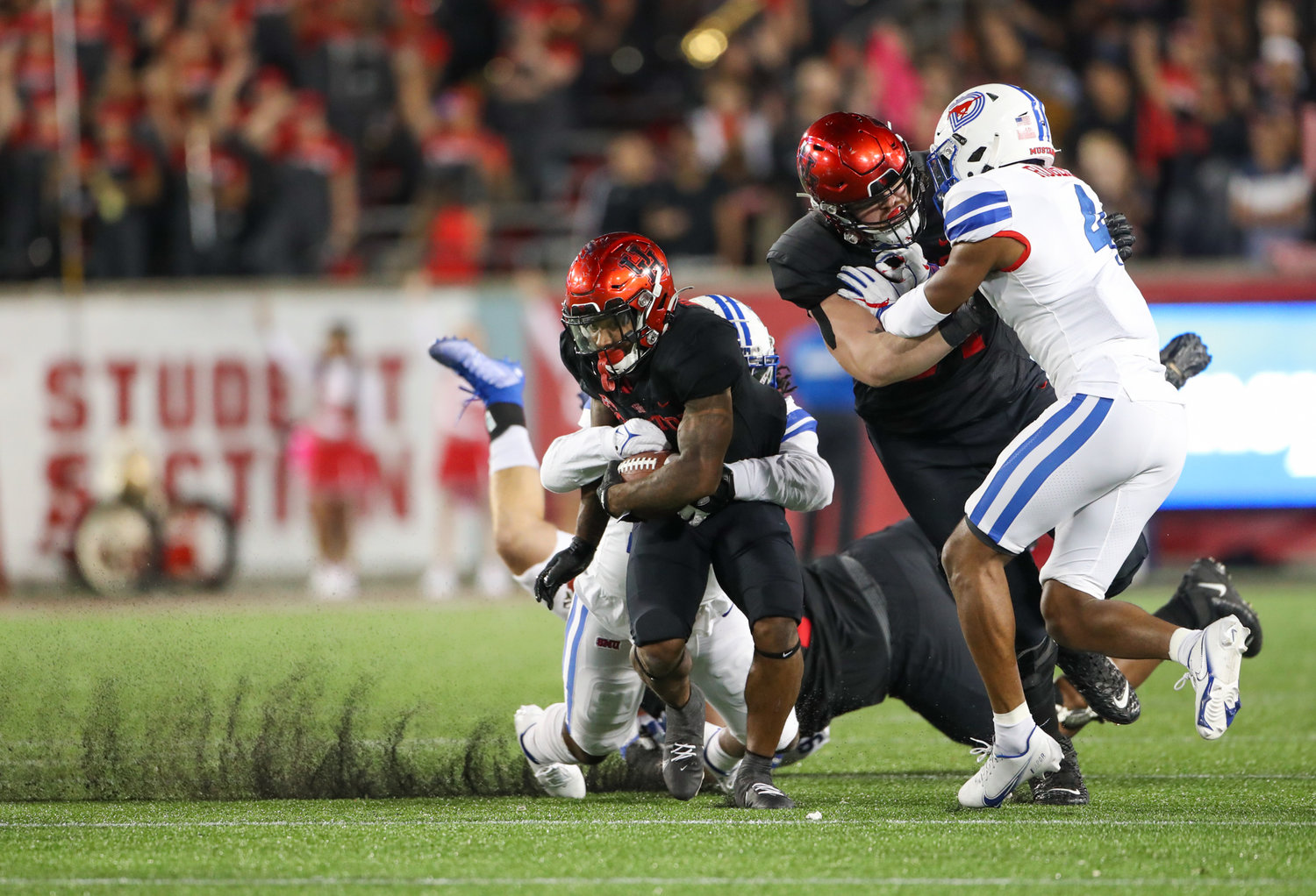 Houston Cougars running back Ta'Zhawn Henry (4) carries the ball during an NCAA football game between Houston and SMU on October 30, 2021 in Houston, Texas.