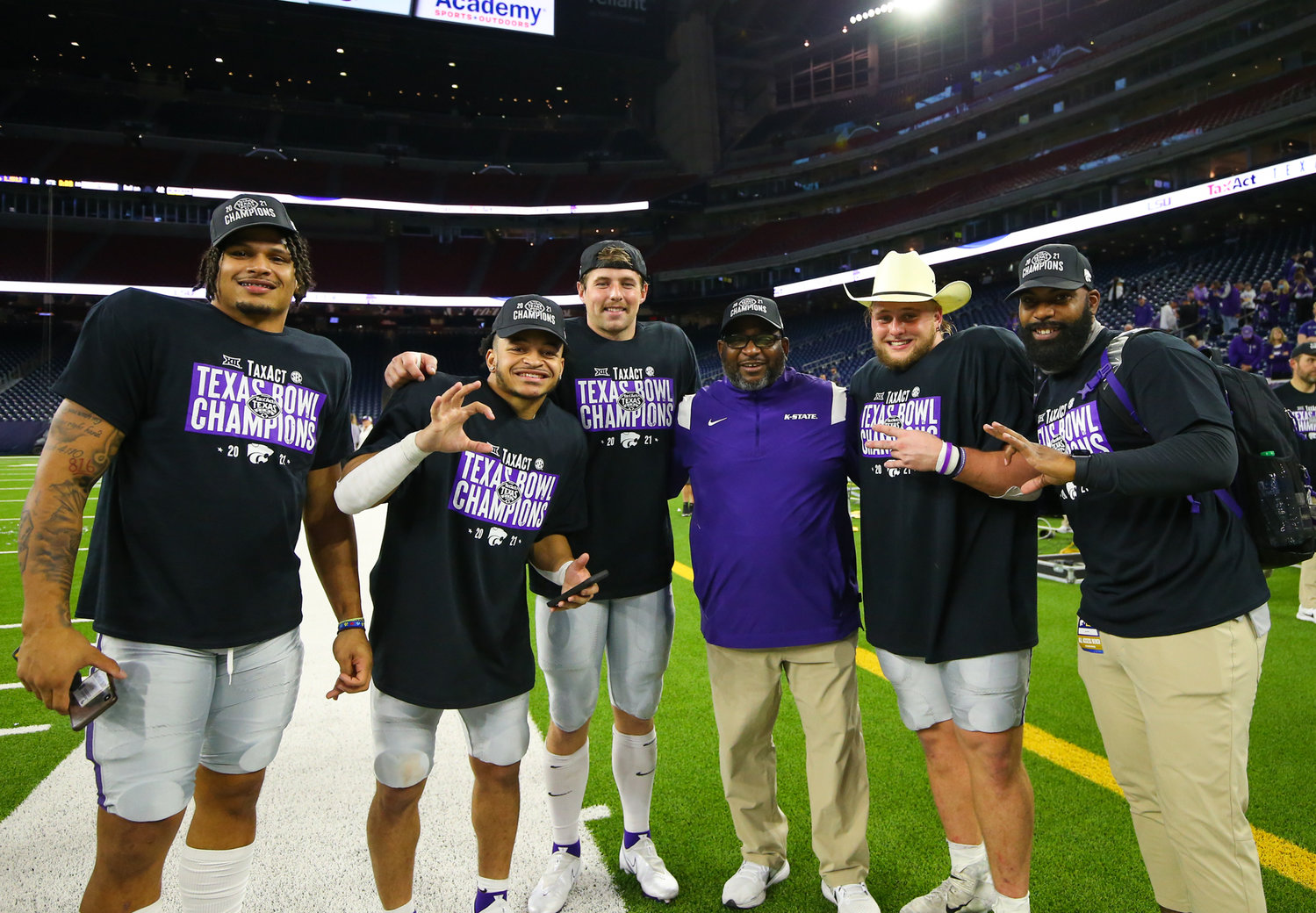 Kansas State Wildcats celebrate a 42-20 win over LSU in the TaxAct Texas Bowl on Jan. 4, 2022 in Houston, Texas. Former Cedar Ridge standout Duece Vaughan (second from left) rushed for 146 yards and three touchdowns and added a receiving touchdown in the game.