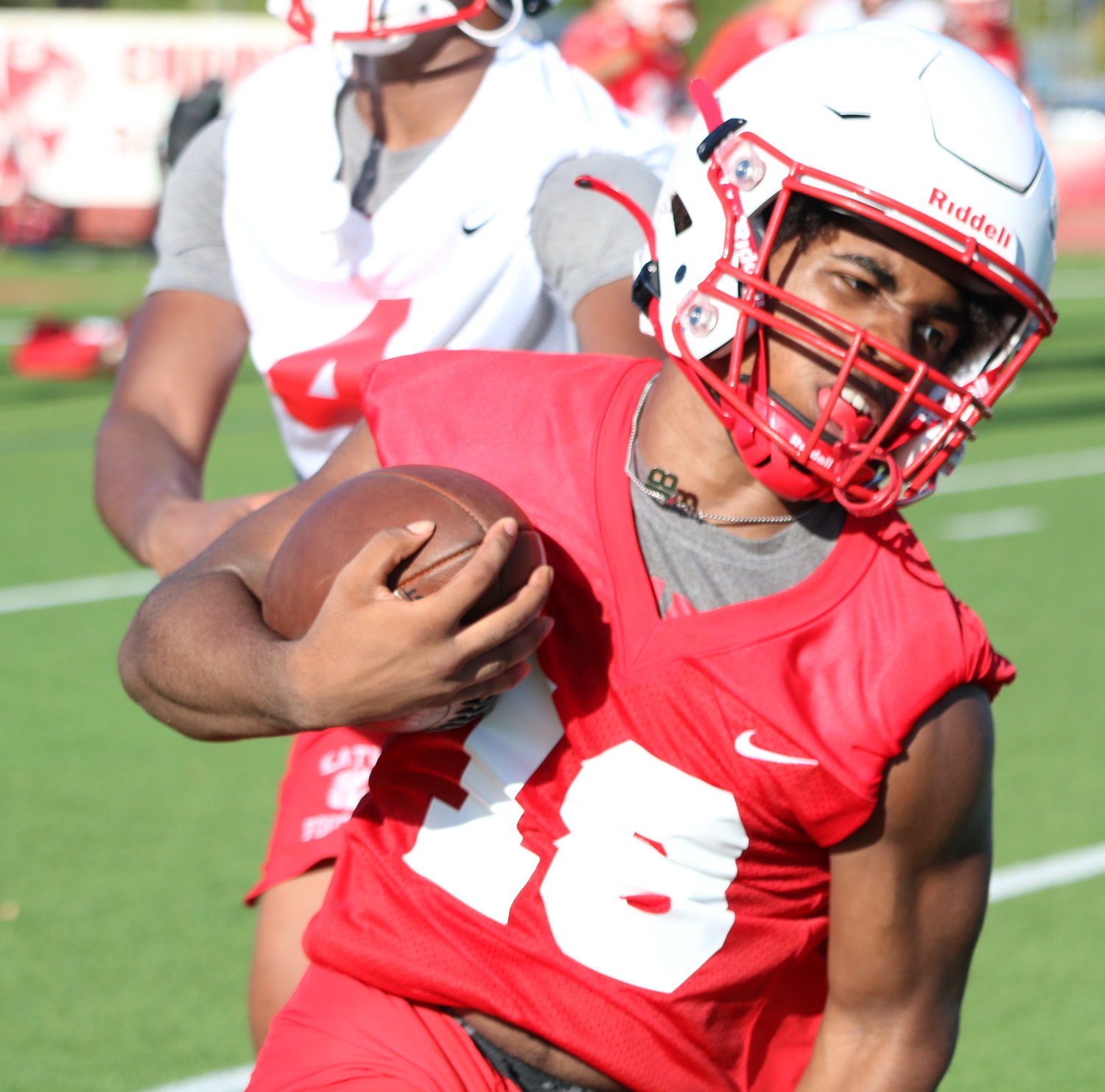 Katy running back Dallas Glass carries the ball during Monday’s practice.