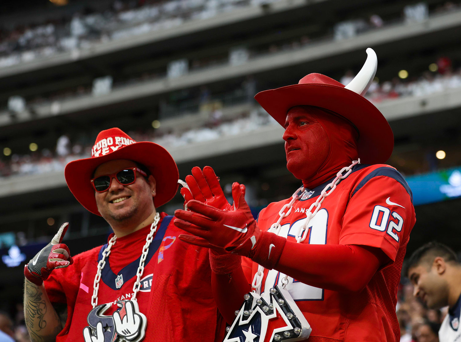 Houston Texans fans cheer during an NFL game between the Texans and the Colts on September 11, 2022 in Houston. The game ended in a 20-20 tie after a scoreless overtime period.