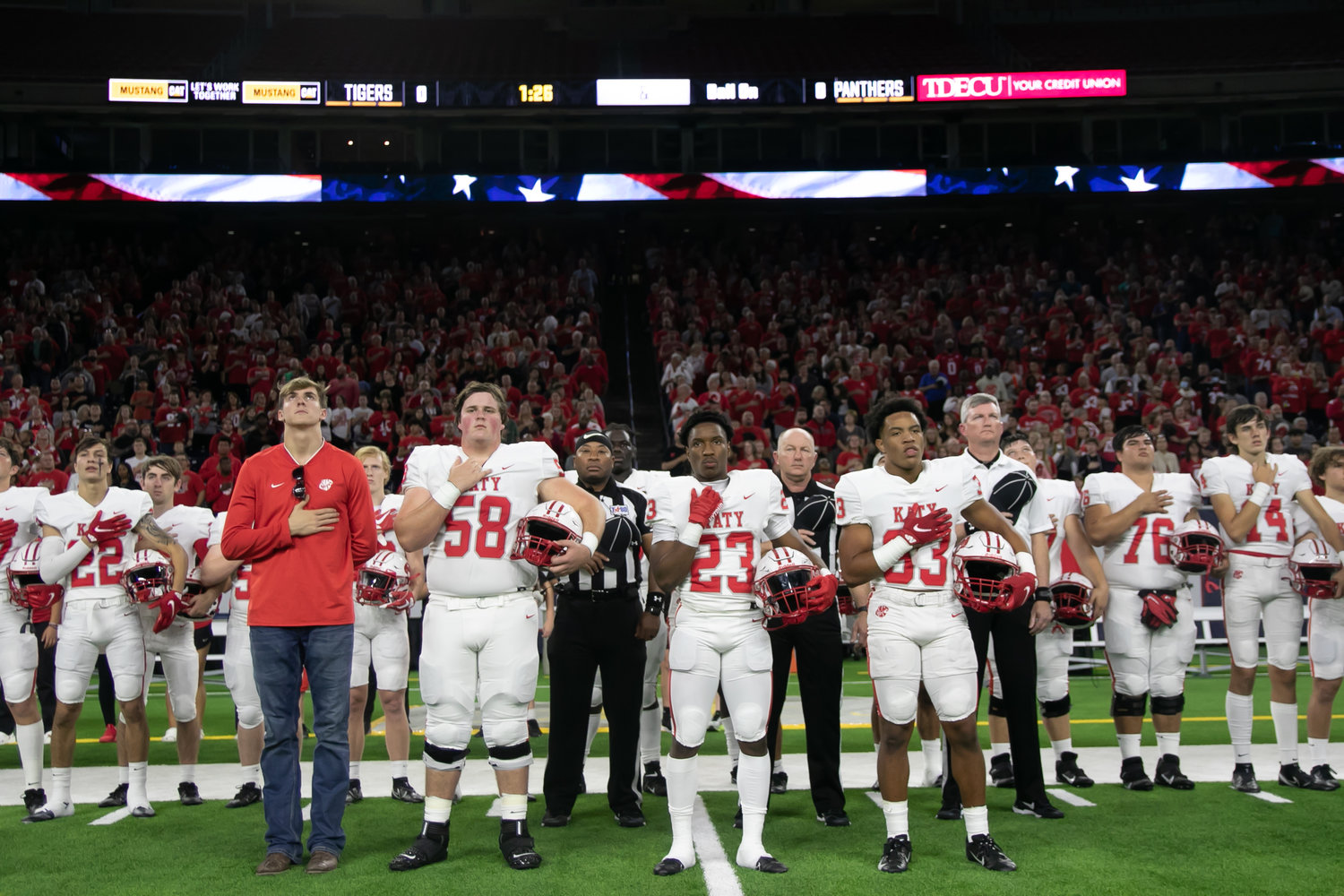 The Katy team captains stand for the national anthem before Friday's Class 6A-Division II Region III Final between Katy and C.E. King at NRG Stadium.
