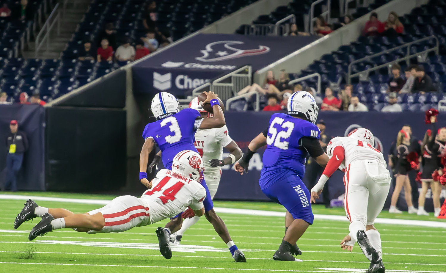 A Katy defenders brings down a C.E. King ballcarrier during Friday's Class 6A-Divison II Region III Final between Katy and C.E. King at NRG Stadium.