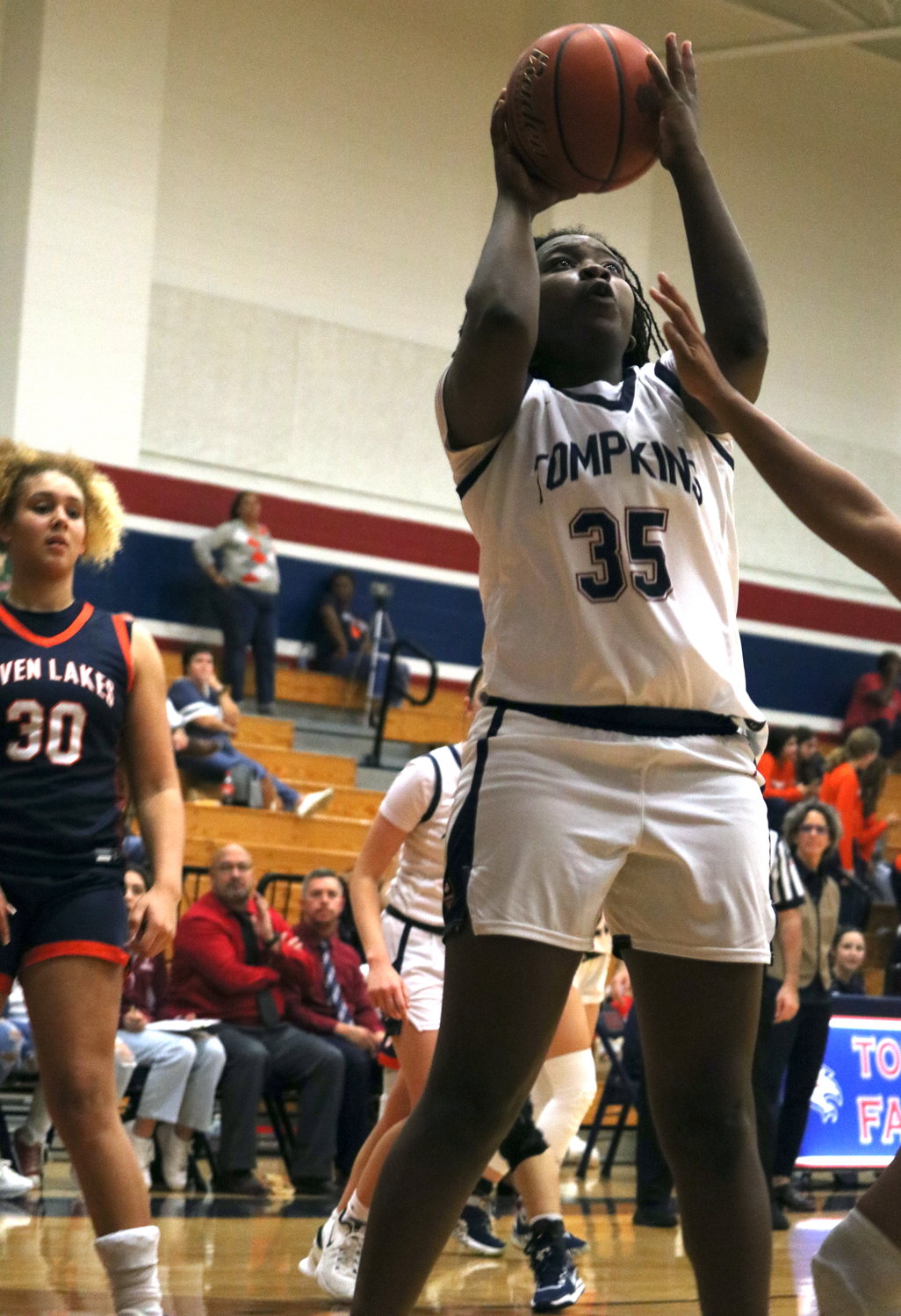 Fiyinfoluwa Adeleye goes up for a layup during Tuesday’s District 19-6A game between Tompkins and Seven Lakes at the Tompkins gym.
