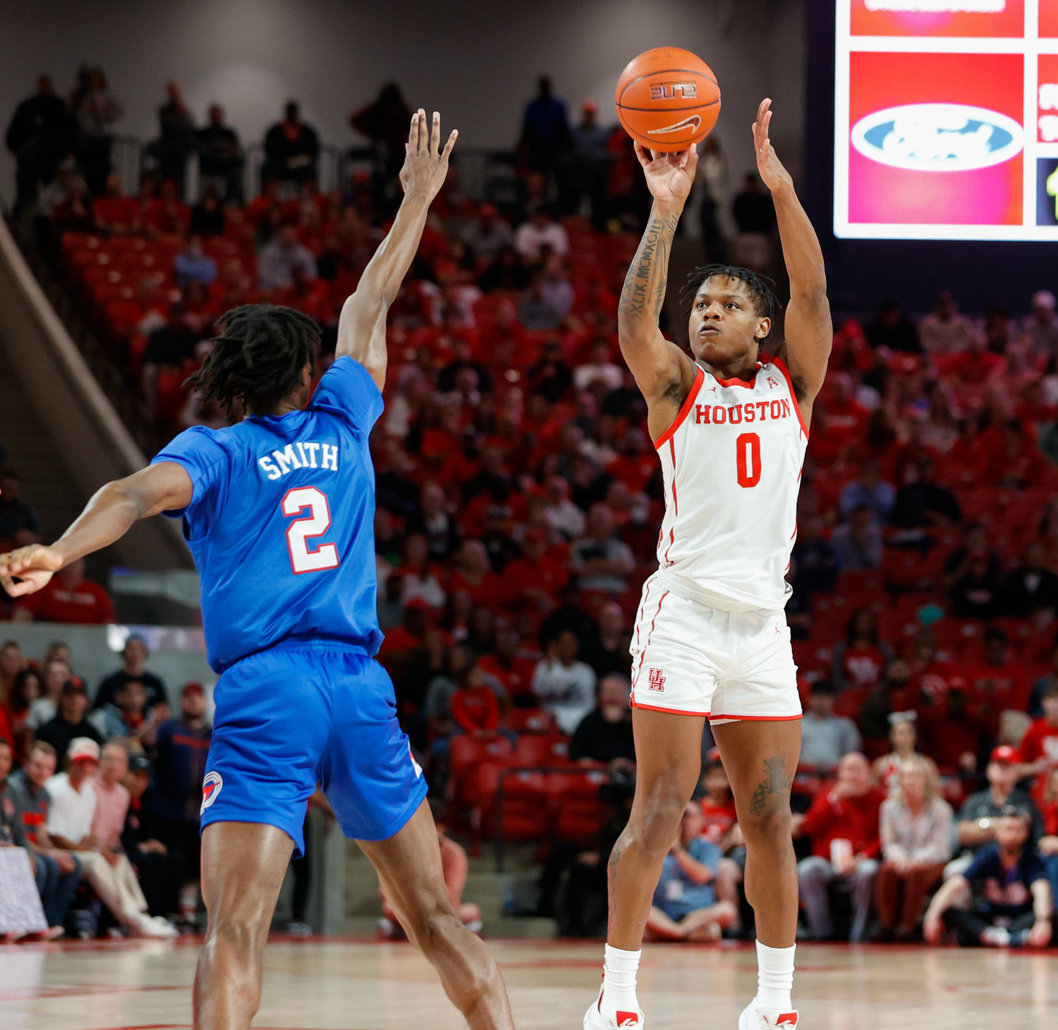 Houston guard Marcus Sasser (0) shoots a jump shot during an NCAA men’s basketball game between the Houston Cougars and the Southern Methodist Mustangs on Jan. 5, 2023 in Houston. Houston won, 87-53,