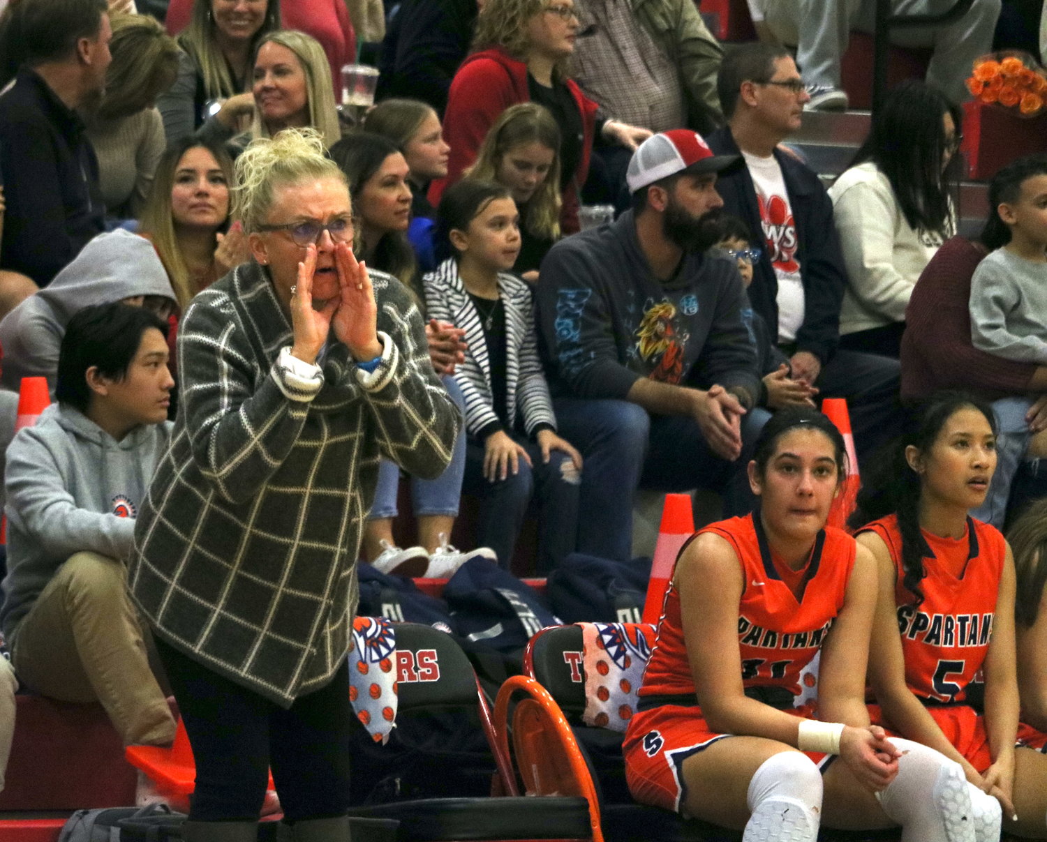 Seven Lakes head coach Angela Spurlock talks to her team during Friday's game between Seven Lakes and Katy at the Katy gym.