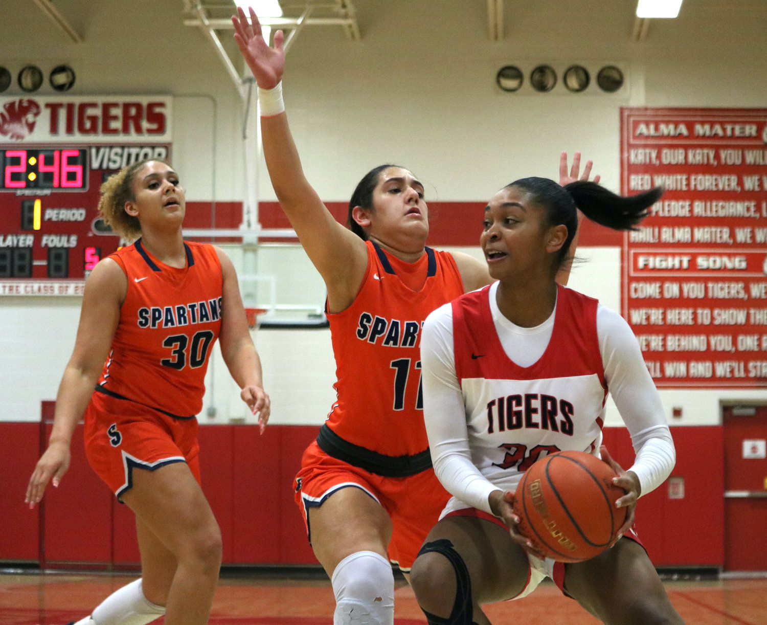 Lyric Barr drives past a defender during Friday's game between Seven Lakes and Katy at the Katy gym.