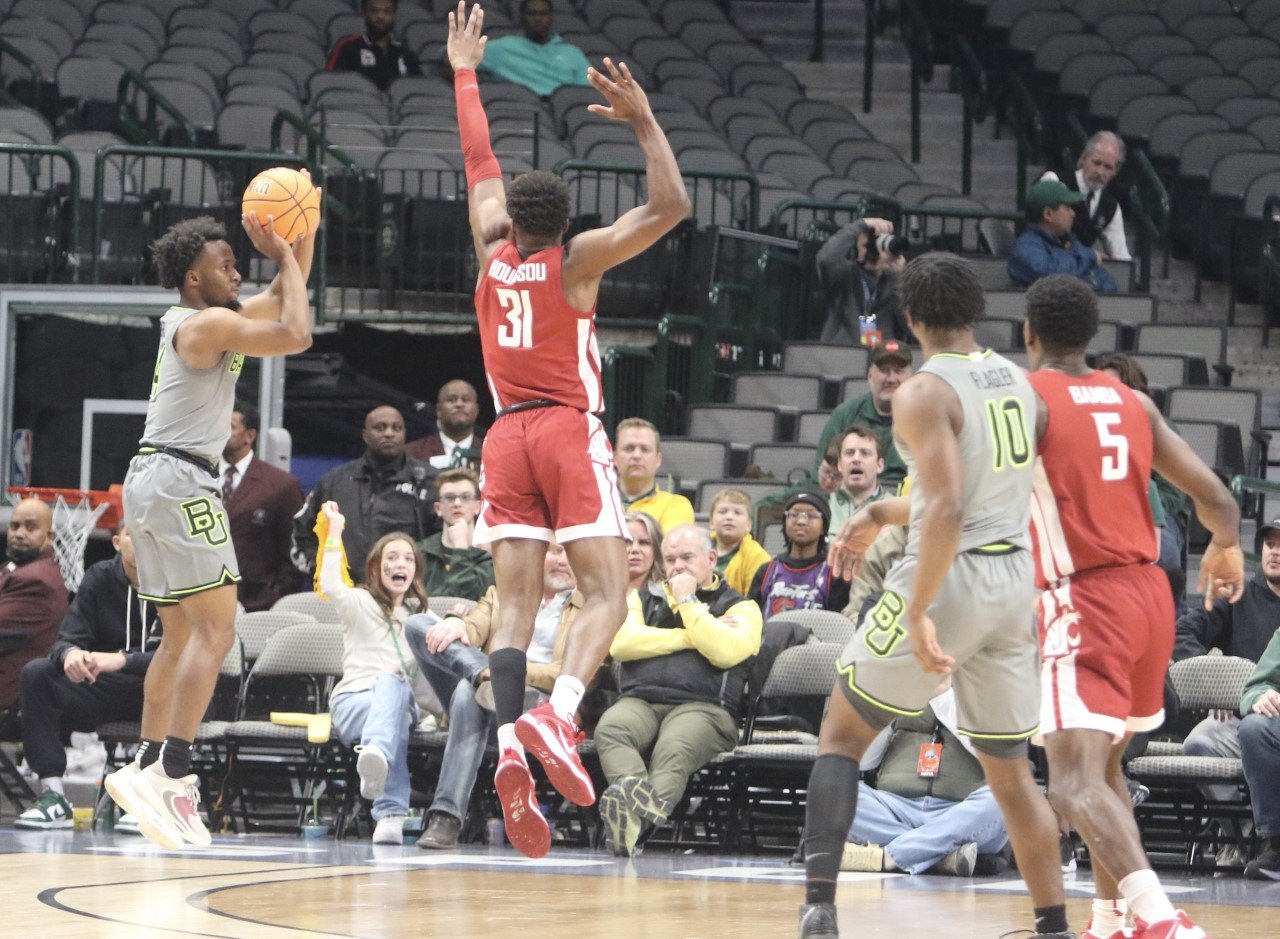 Baylor guard and Morton Ranch graduate L.J. Cryer shoots a 3-pointer in a game against Washington State this season.