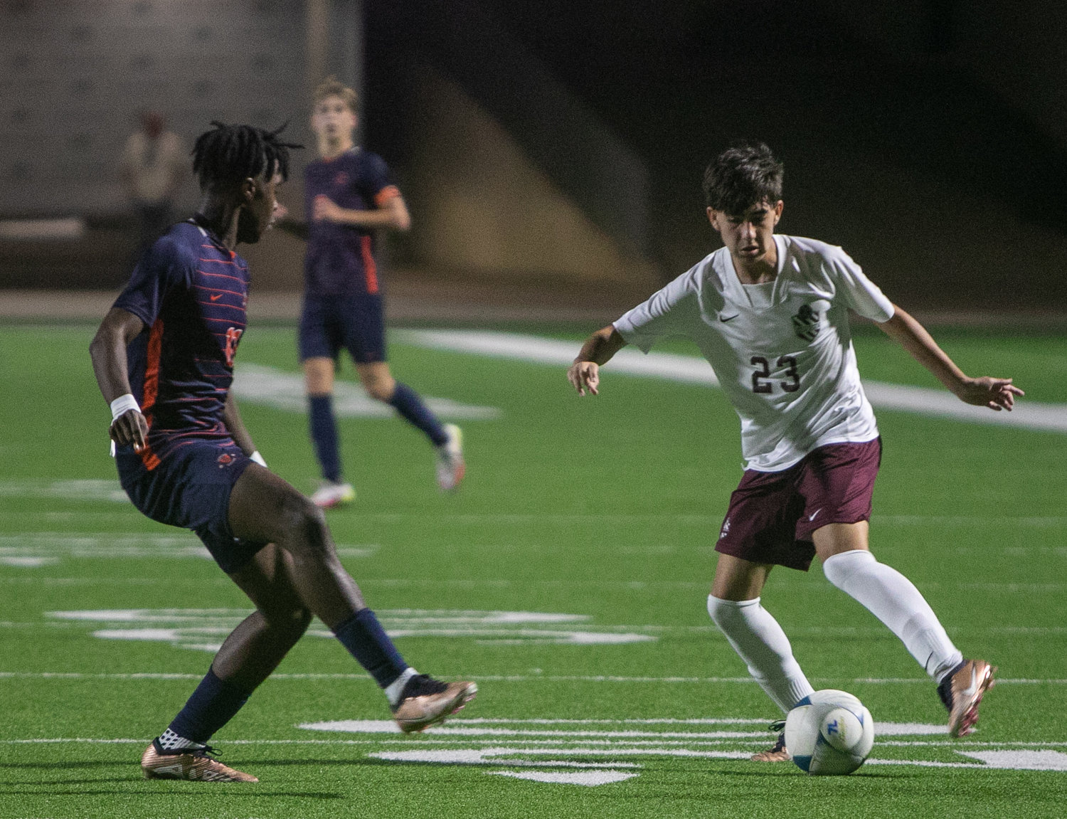 Noah Bosso dribbles around a player during Friday's Class 6A Regional Quarterfinal game between Seven Lakes and Cinco Ranch at Legacy Stadium.