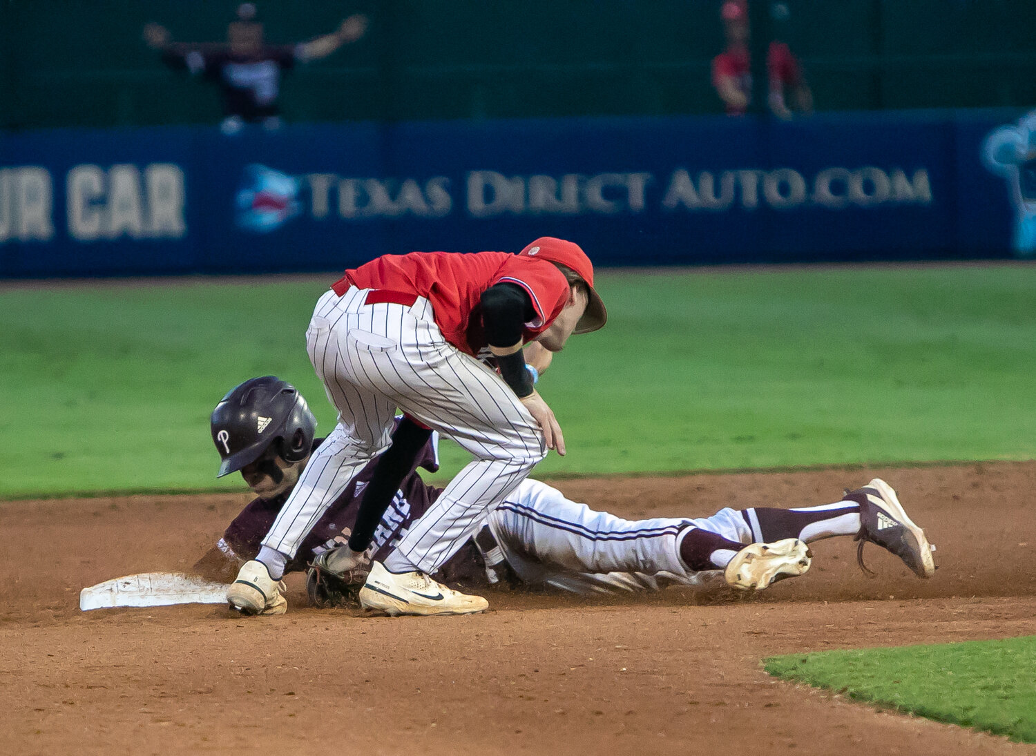 Graham Laxton tags out a runner during Friday's Regional Final between Katy and Pearland at Constellation Field in Sugar Land.