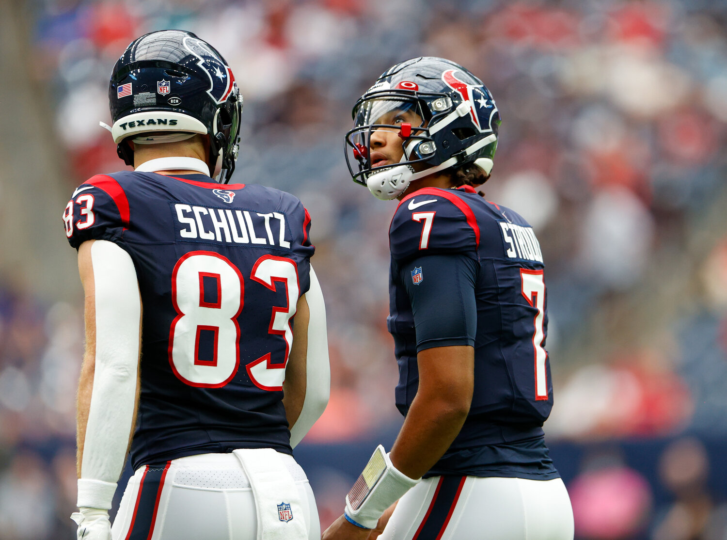 Houston Texans quarterback C.J. Stroud (7) looks up at the video board while talking to tight end Dalton Schultz (83) after an unsuccessful third down attempt during an NFL preseason game between the Texans and the Dolphins Jaguars on August 19, 2023 in Houston.