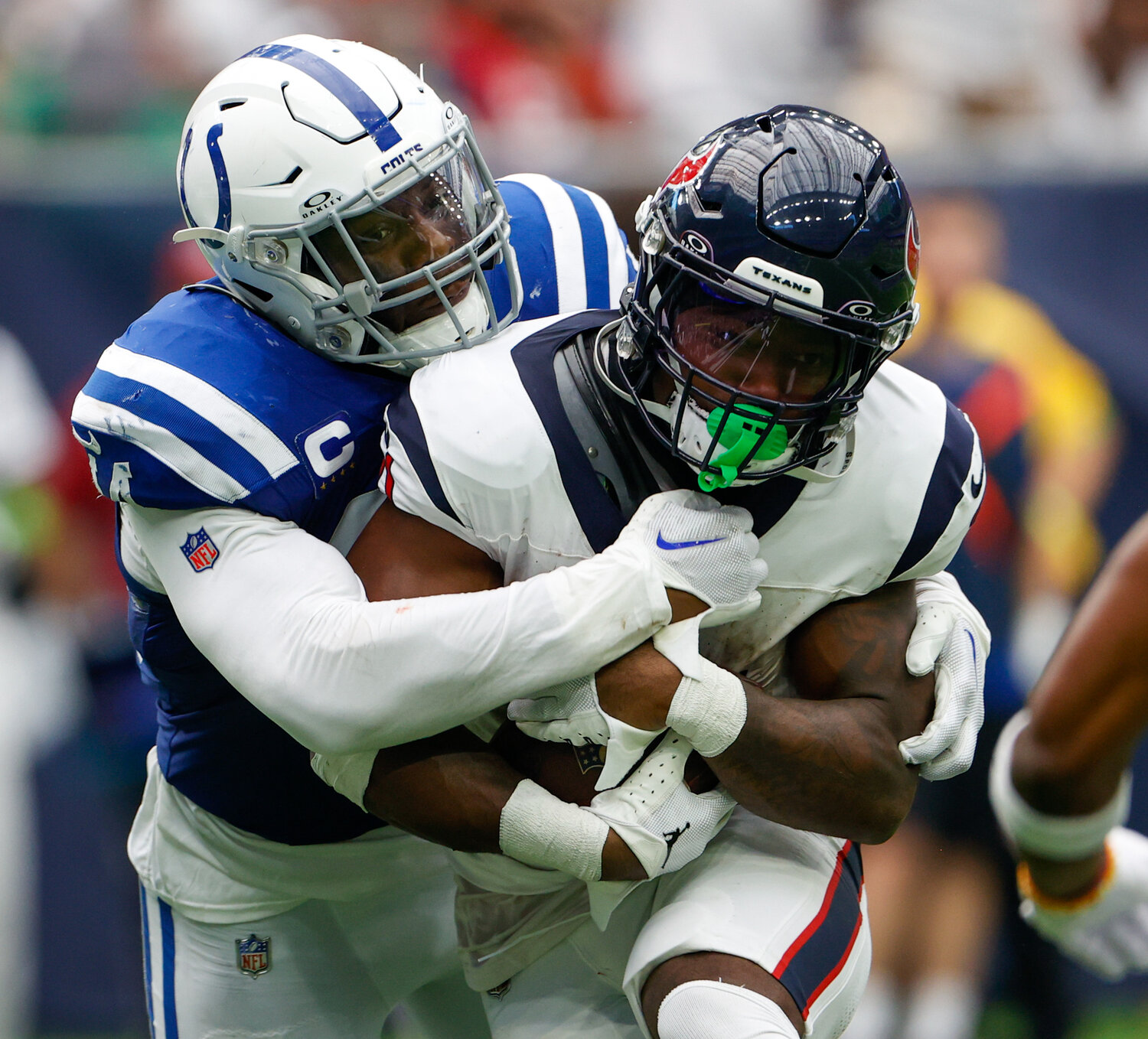 Colts linebacker Zaire Franklin (44) tackles Texans running back Dameon Pierce (31) during an NFL game between the Texans and the Colts on September 17, 2023 in Houston. The Colts won, 31-20.