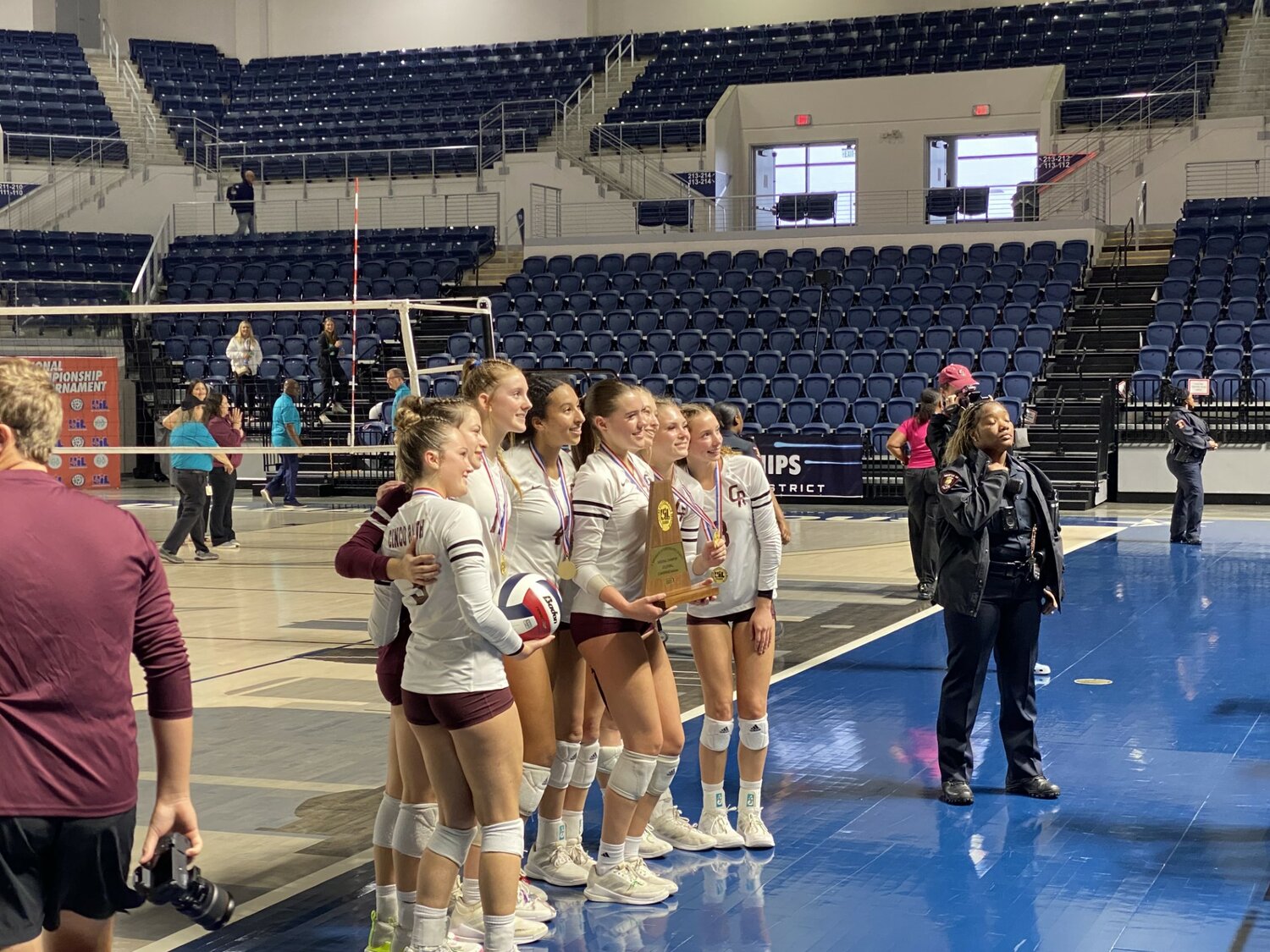 Cinco Ranch players pose with their Regional Tournament Championship Trophy after Saturday’s game against Seven Lakes at Delmar Field House.