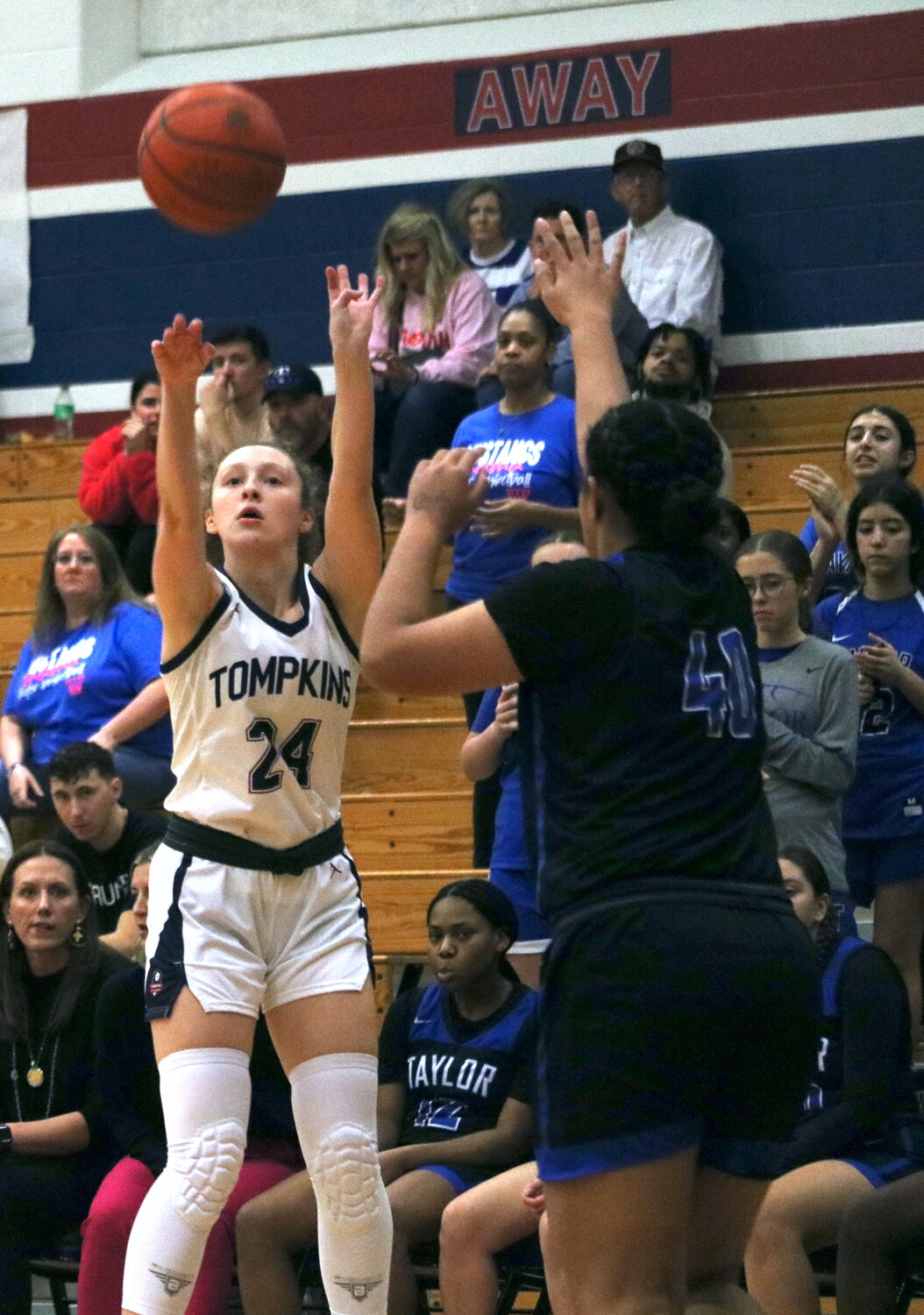 Gabby Panter shoots a 3-pointer during Friday's game between Taylor and Tompkins at the Tompkins gym.