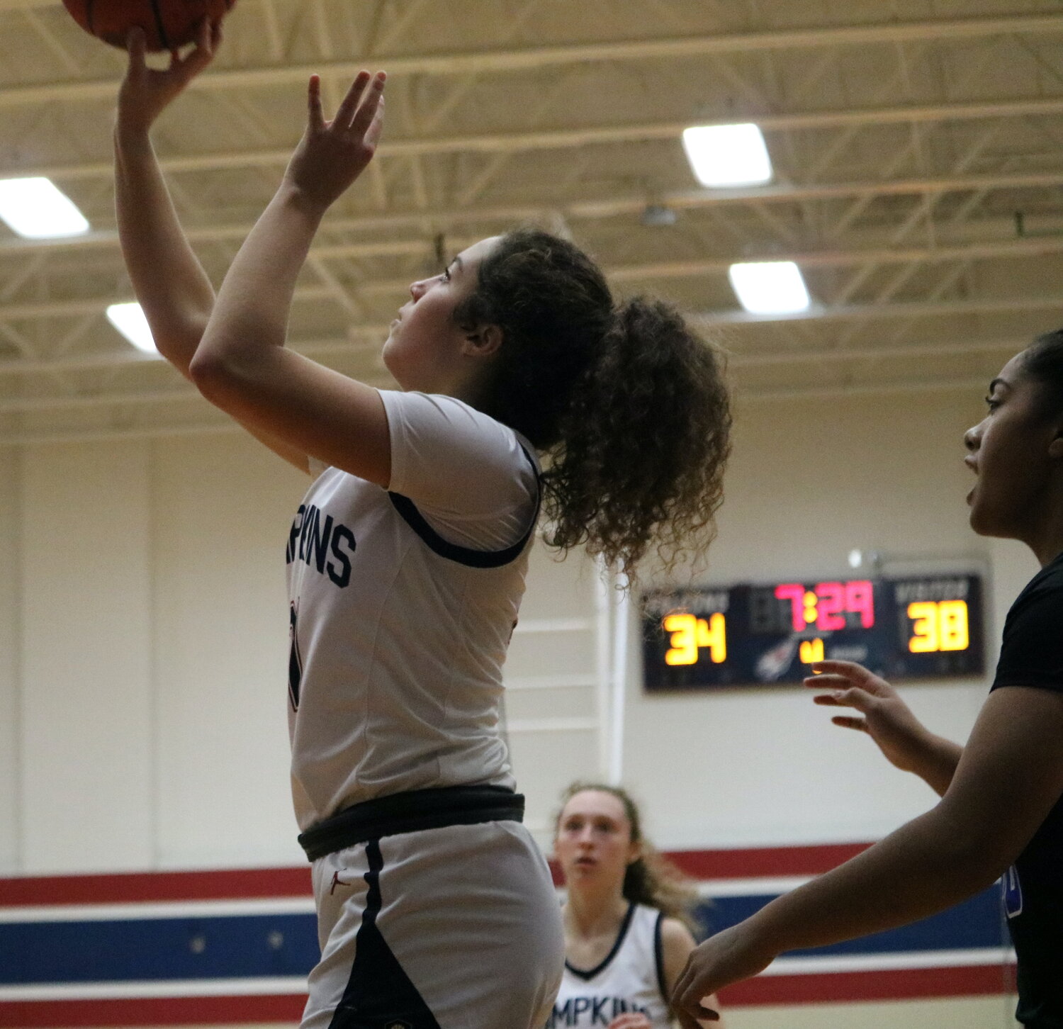 Caitlyn D’Addieco shoots during Friday's game between Taylor and Tompkins at the Tompkins gym.